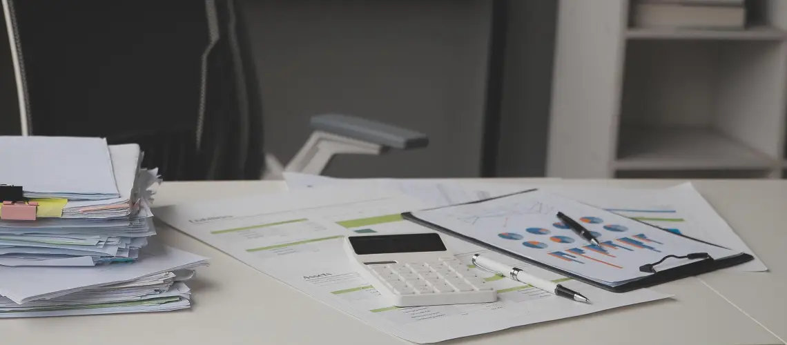 Professional conducting business valuation Darwin with financial documents in office setting